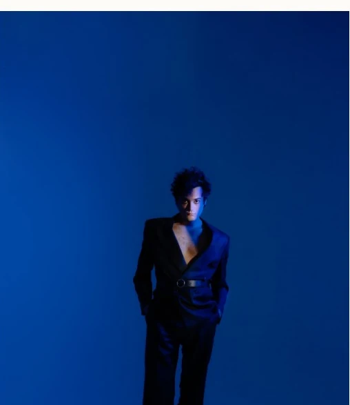 Alejandro Molinari portrait in blue light from his previous website